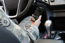 guy using phone in car